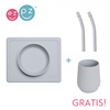 EZPZ Silikonowa miseczka z podkładką 2w1 Mini Bowl + GRATIS silikonowy kubeczek Mini Cup 120ml z 2 słomkami  pastelowa szarość